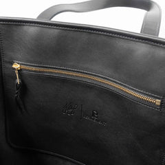 Interior zip pocket of the Frank Clegg Leather Market Tote Bag Black