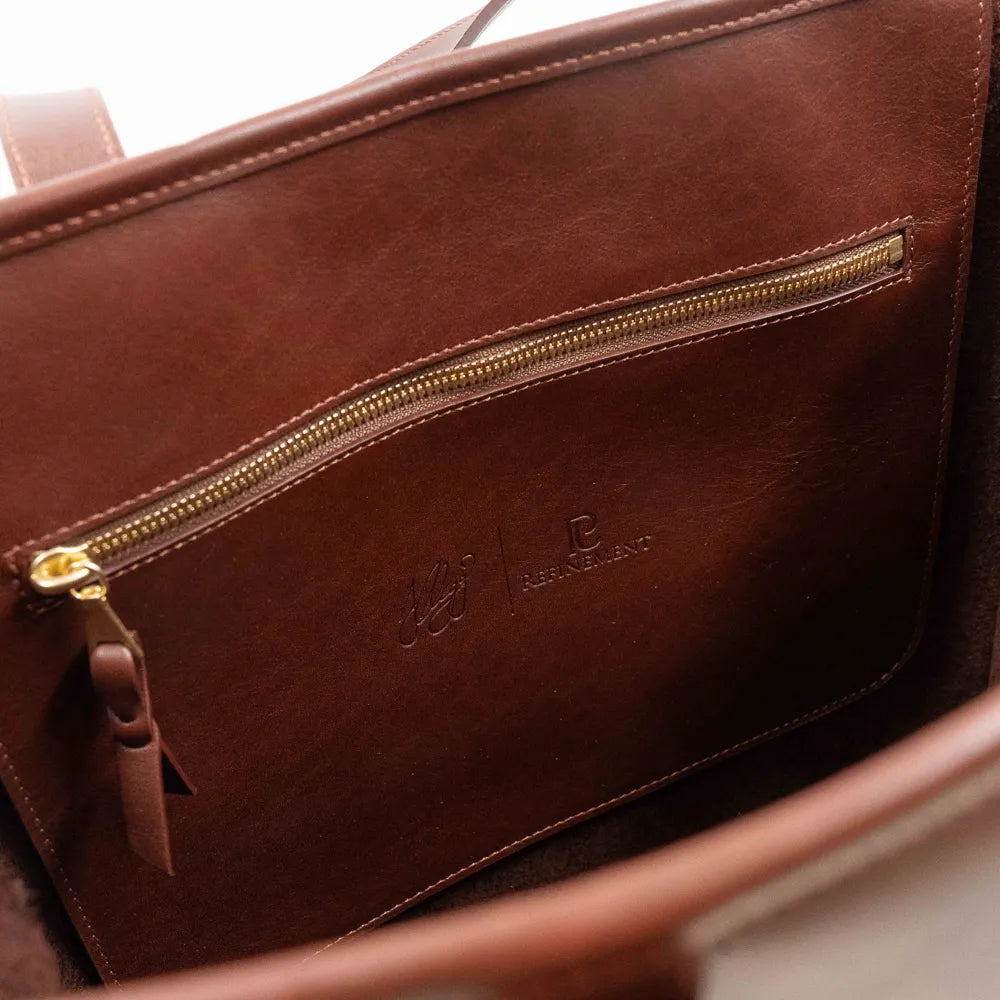 Interior zip pocket of the Frank Clegg Leather Market Tote Bag Chestnut