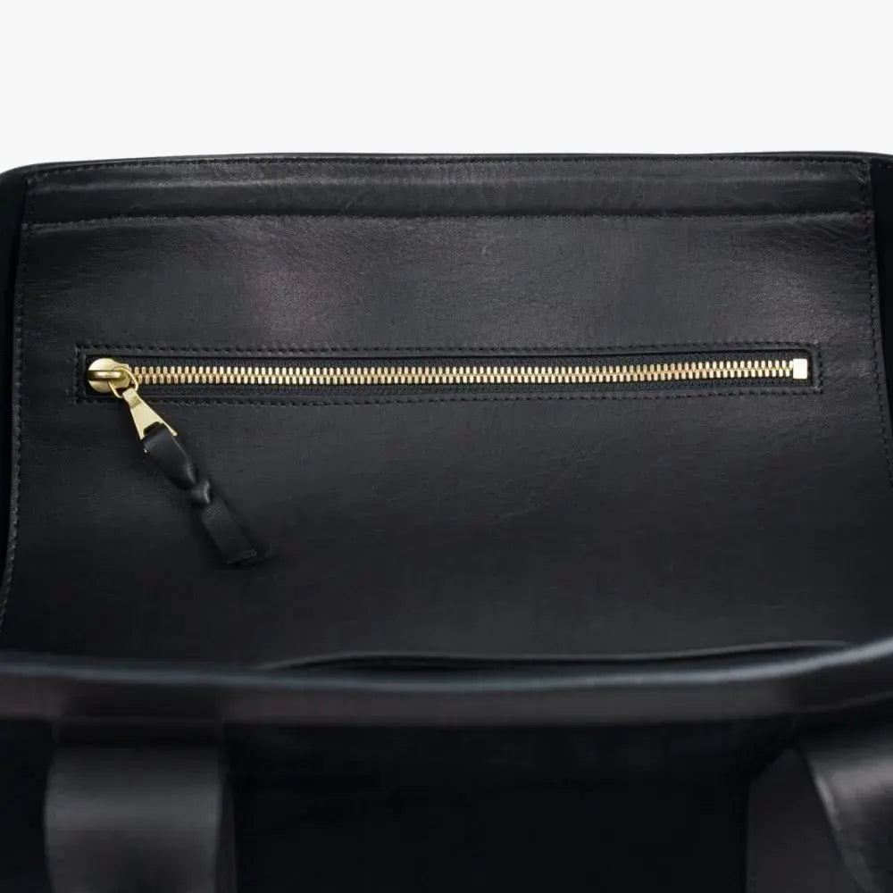 Interior zip pocket of the Frank Clegg for Refinement Suede Tote Bag Black