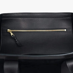 Interior zip pocket of the Frank Clegg for Refinement Suede Tote Bag Black