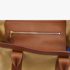 Interior zip pocket of the Frank Clegg for Refinement Suede Tote Bag Sand
