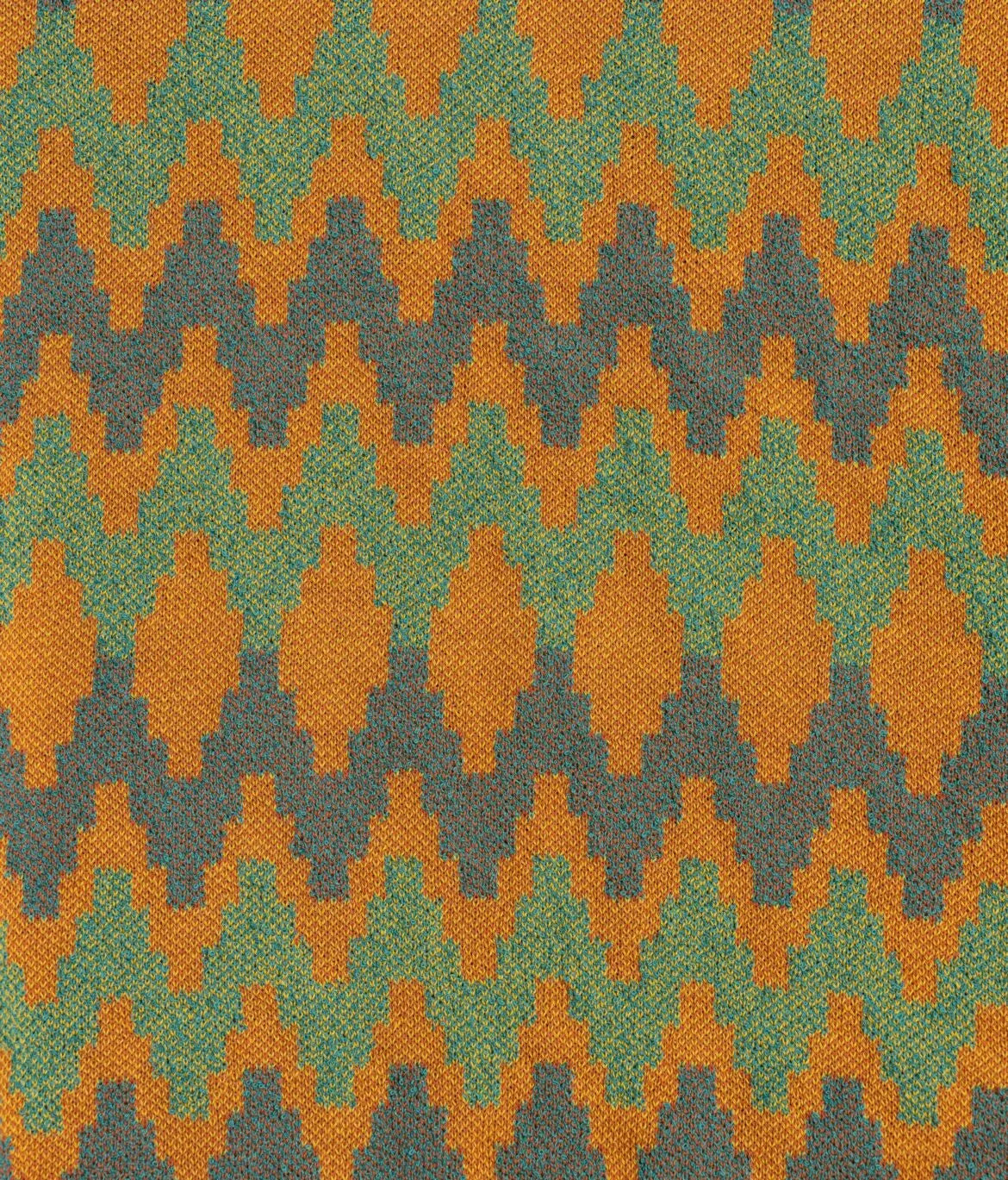 Close-up fabric texture of the Gallia Coleman Polo Jacquard Rust Green showing the woven jacquard pattern and depth.
