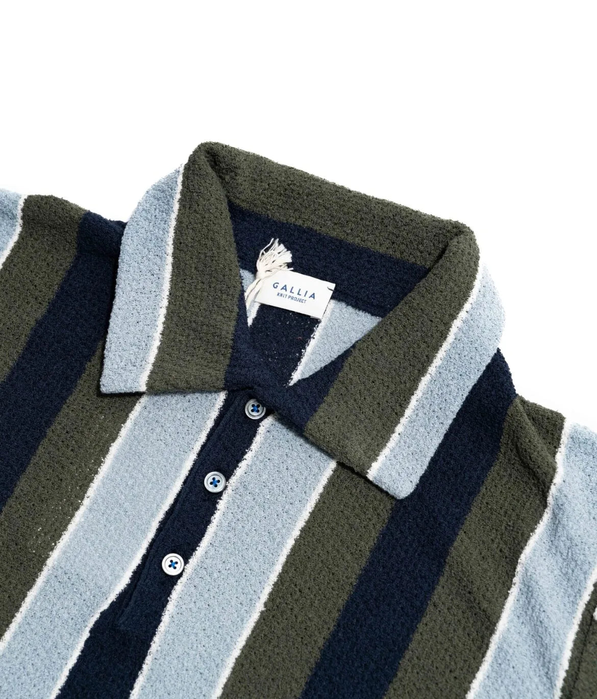 Close-up of the collar of the Gallia Durant Polo in Navy, Olive, and Blue, highlighting the color-block design and knit texture.