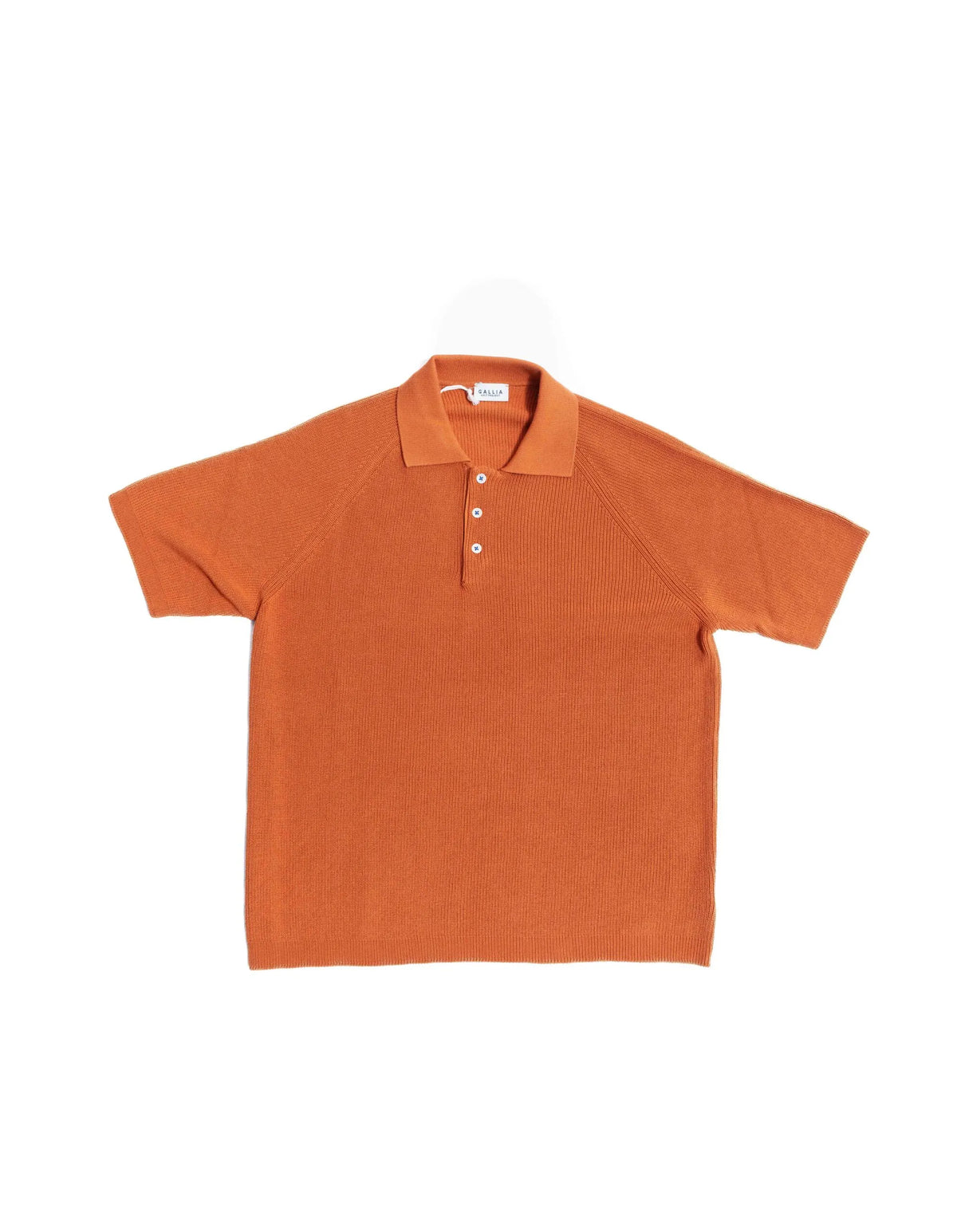 Front view of the Gallia Madison Polo in Rust Plain highlighting its minimal, solid-color design.