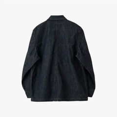 Back view highlighting the clean panel construction, straight hem, and natural drape of the indigo denim.