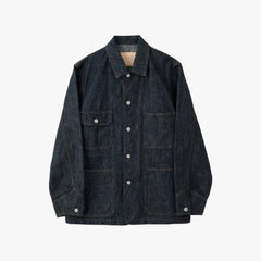 Front view of the Hand Room Denim Coverall Indigo showing the chore jacket silhouette, patch pockets, and mid-weight indigo denim texture.