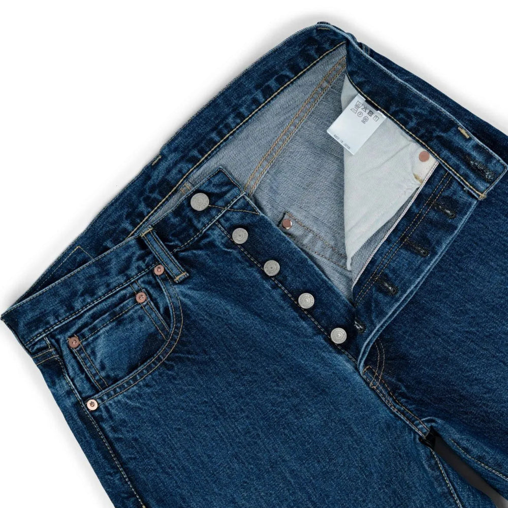 Close-up of the waistband button on the Hand Room Exclusive for Refinement High Rise Regular Fit Mid Washed jeans