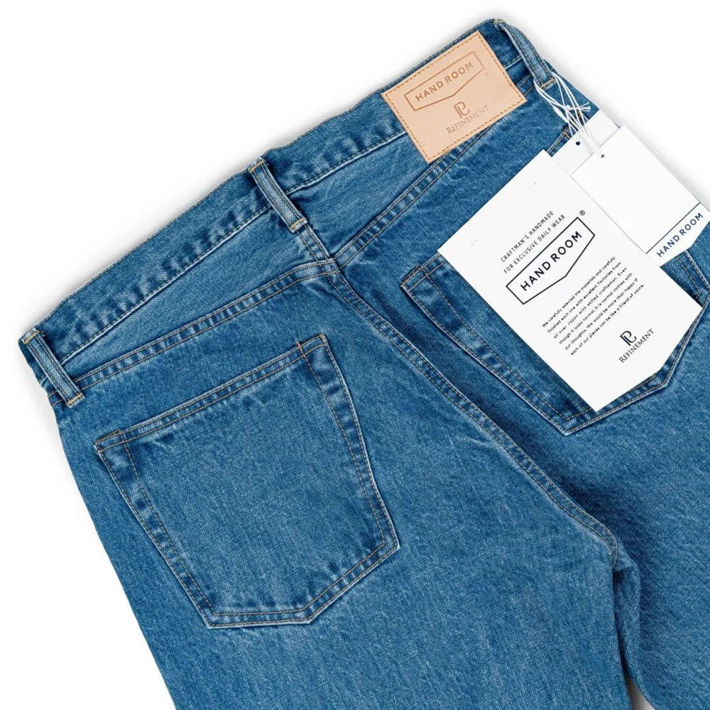 Back pocket detail of the Hand Room Exclusive for Refinement Wide Fit Light Washed jeans