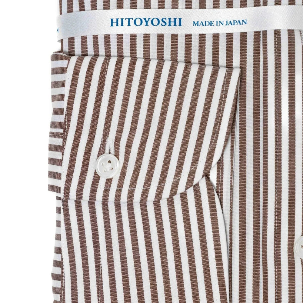 Close-up of the cuff showing button arrangement, stitching, and stripe detailing.