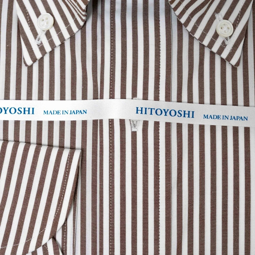Close-up of the red stripe broadcloth fabric showing fine weave, smooth texture, and sharp stripe pattern.