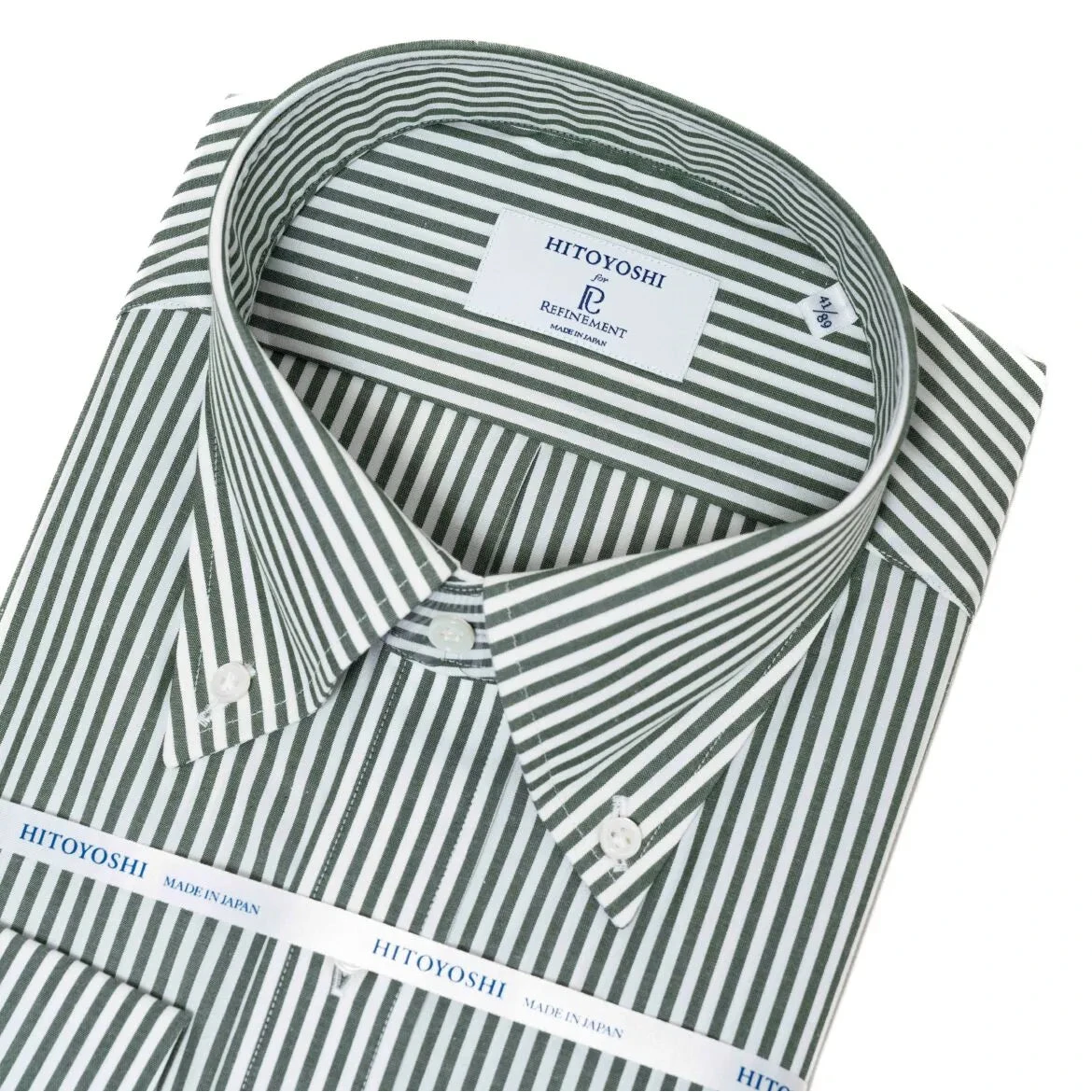 Close-up of the button-down collar showing its roll shape, stitching precision, and green stripe alignment.