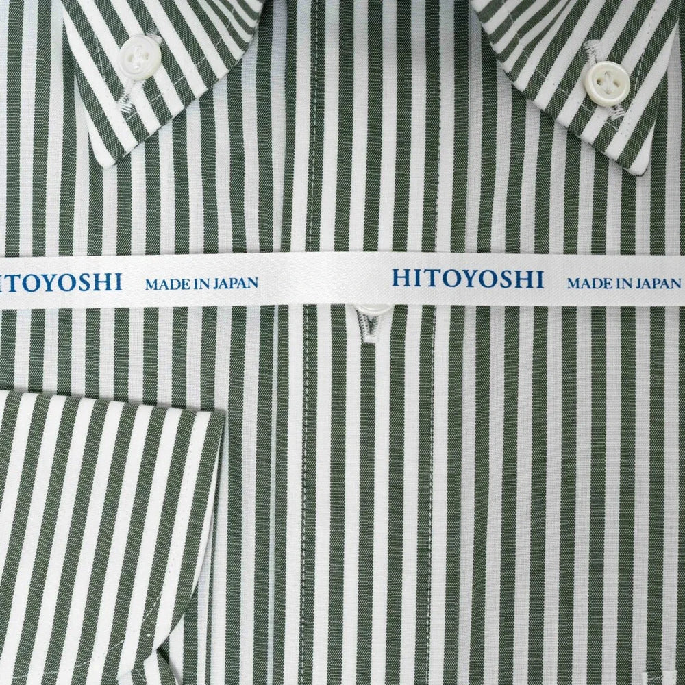 Close-up of the broadcloth green stripe fabric showing its fine weave, smooth handfeel, and crisp stripe clarity.