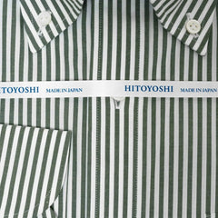 Close-up of the broadcloth green stripe fabric showing its fine weave, smooth handfeel, and crisp stripe clarity.