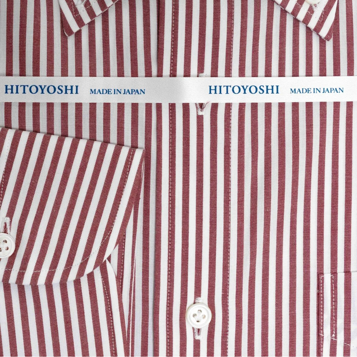 Folded front view of the Hitoyoshi Broadcloth Button Down Red Stripe shirt