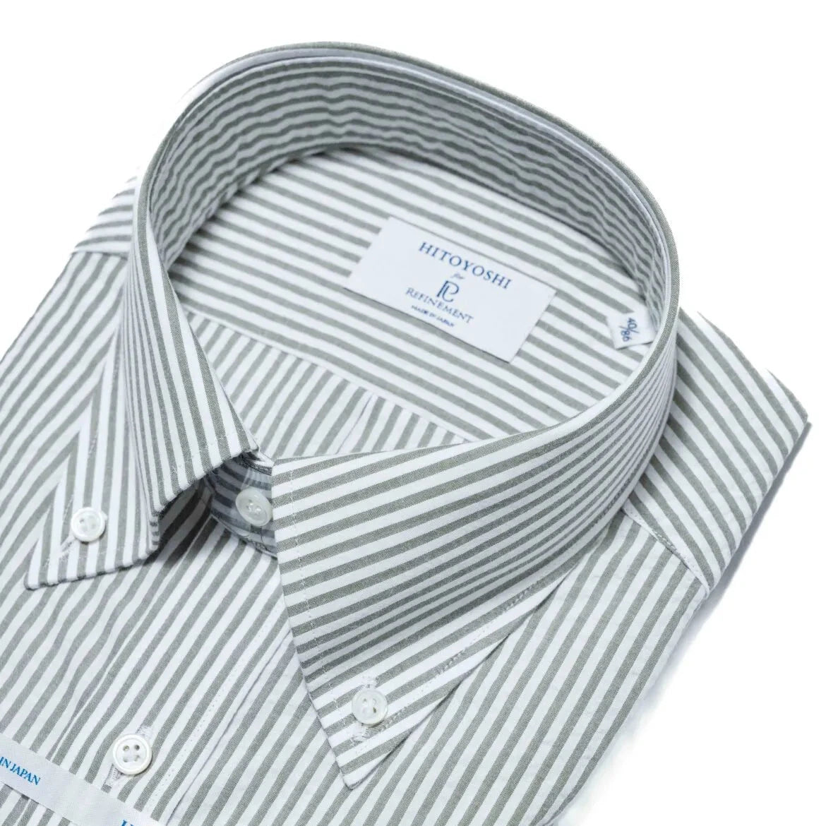 Close-up of the button-down collar showing the roll shape, stitching detail, and puckered seersucker texture.