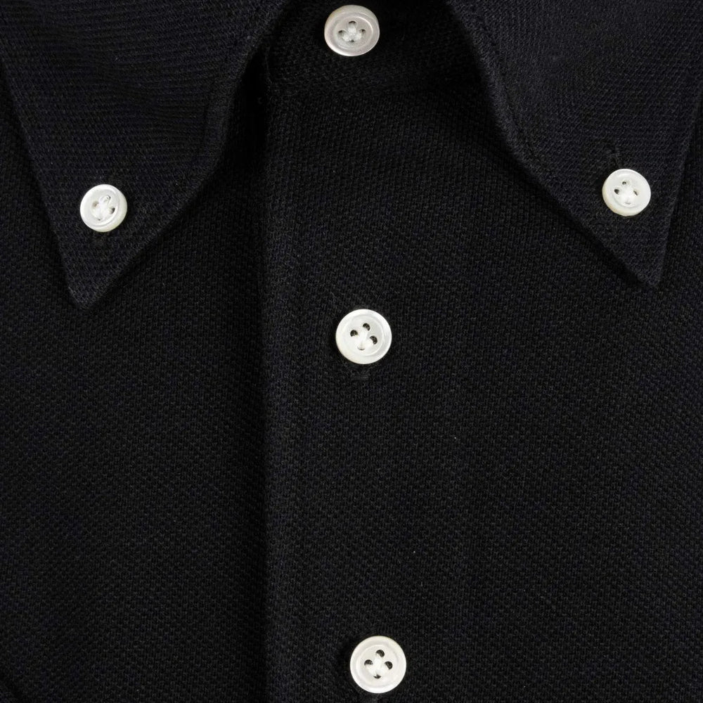 Button close-up detail of the Hitoyoshi for Refinement Button Down Polo Black