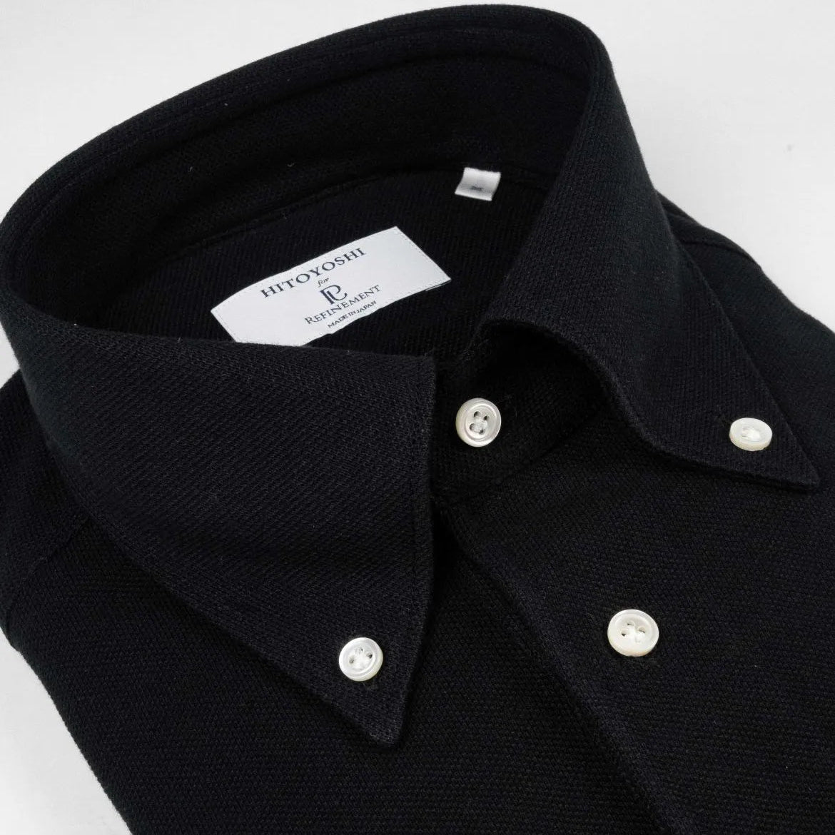 Collar detail of the Hitoyoshi for Refinement Button Down Polo Black