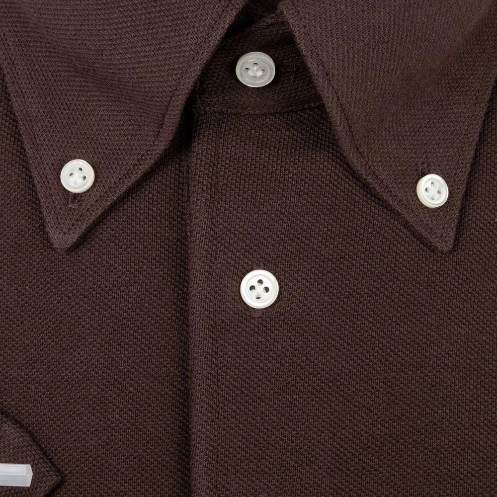 Close-up of the front placket showing button placement, knit density, and clean finishing.