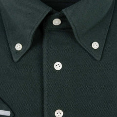 Close-up of the button detailing on the Hitoyoshi for Refinement Button Down Polo Dark Green, showing the button texture, stitching precision, and knit placket finishing.