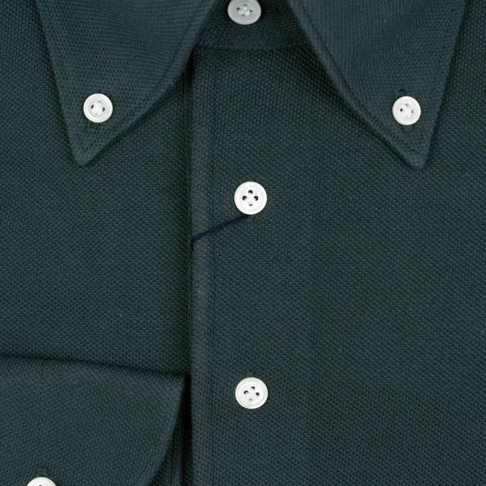 Close-up of the placket showing button layout, knit density, and clean finishing.