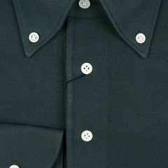 Close-up of the placket showing button layout, knit density, and clean finishing.