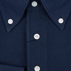 Close-up of the front placket showing button layout, knit density, and clean finishing.