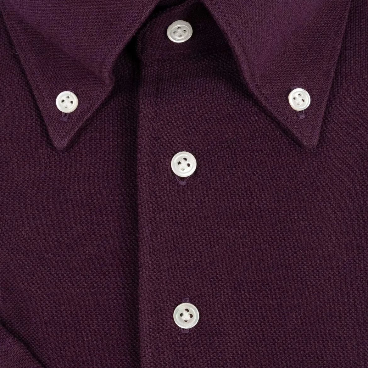 Button close-up detail of the Hitoyoshi for Refinement Button Down Polo Maroon