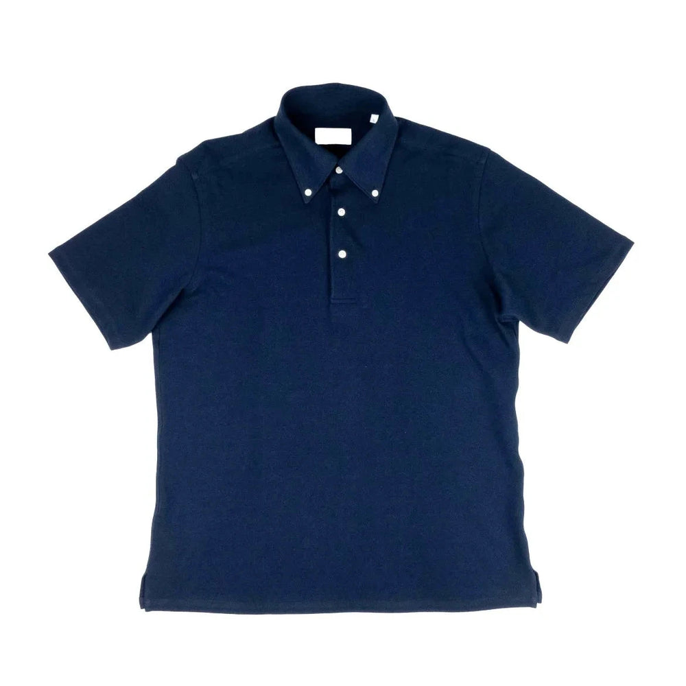 Front view of the Hitoyoshi for Refinement Button Down Polo Navy showing the structured polo silhouette, button-down collar, and deep navy knit texture.