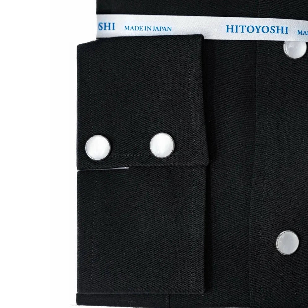 Close-up of the snap buttons showing metallic finish, button design, and placket construction.