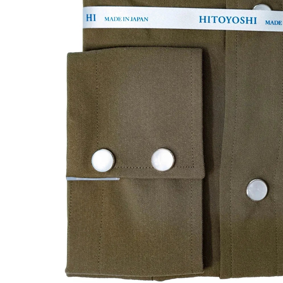 Close-up of the snap buttons showing metallic finish, polished look, and placket detailing.