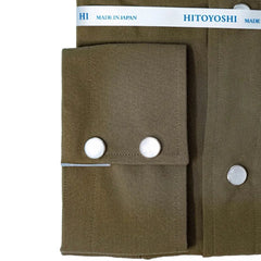 Close-up of the snap buttons showing metallic finish, polished look, and placket detailing.