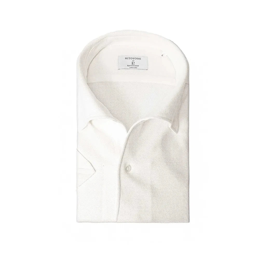 Folded view of the Hitoyoshi for Refinement One Piece Collar Polo White showing the collar roll, knit texture, and tidy folding.