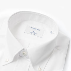 Close-up of the button-down collar showing the gentle collar roll, stitching precision, and pinpoint Oxford texture.