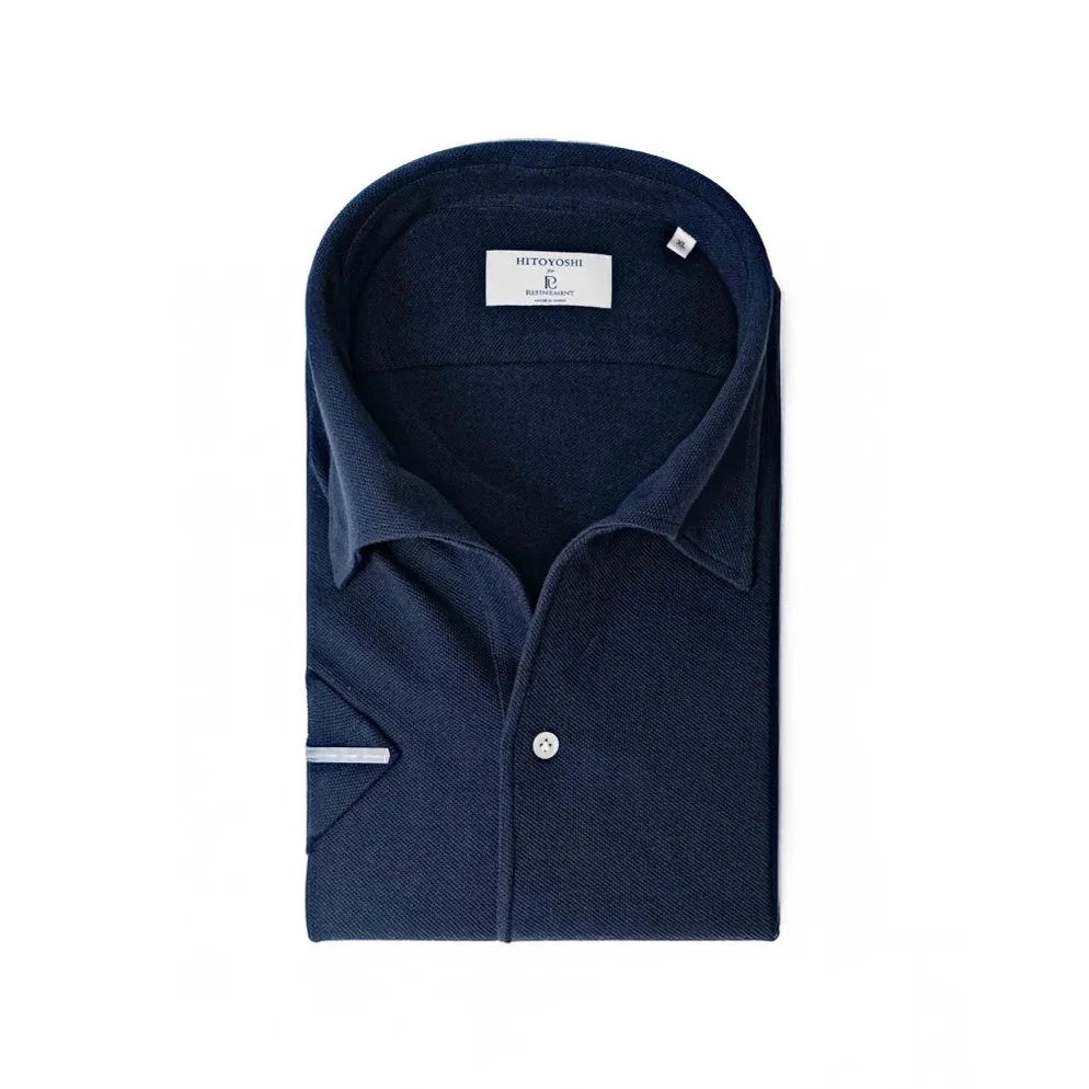 Folded view of the Hitoyoshi for Refinement One Piece Collar Polo Navy showing the collar roll, knit texture, and neat folding.