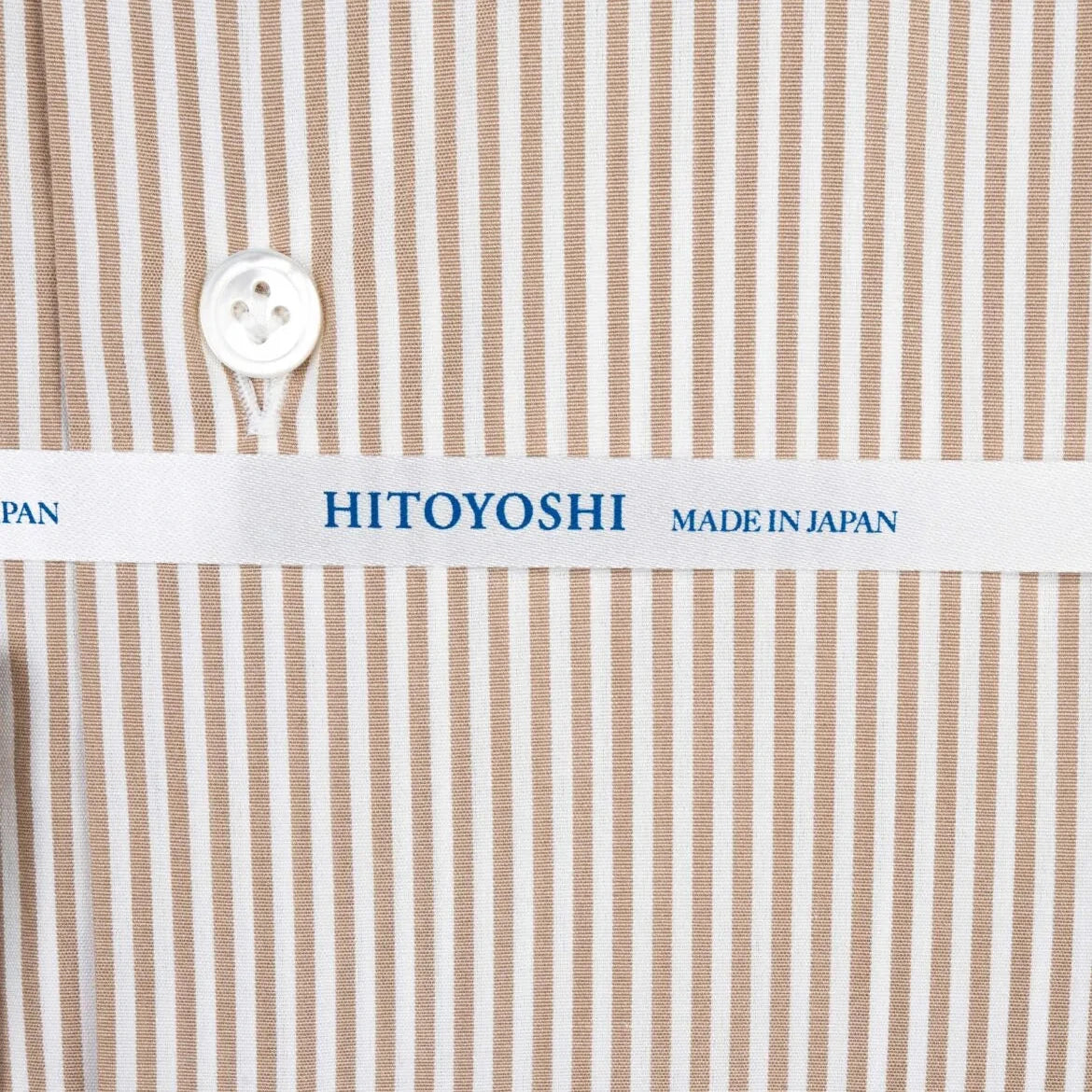 Close-up of the brown candy stripe fabric showing smooth texture, fine weave, and crisp stripe clarity.