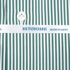 Close-up of the green candy stripe fabric showing smooth broadcloth weave, crisp texture, and vivid stripe pattern.