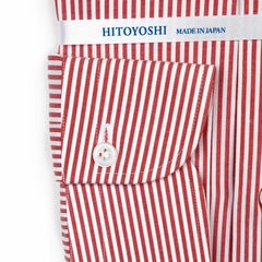 Close-up of the cuff showing stitching, button detail, and stripe continuation.