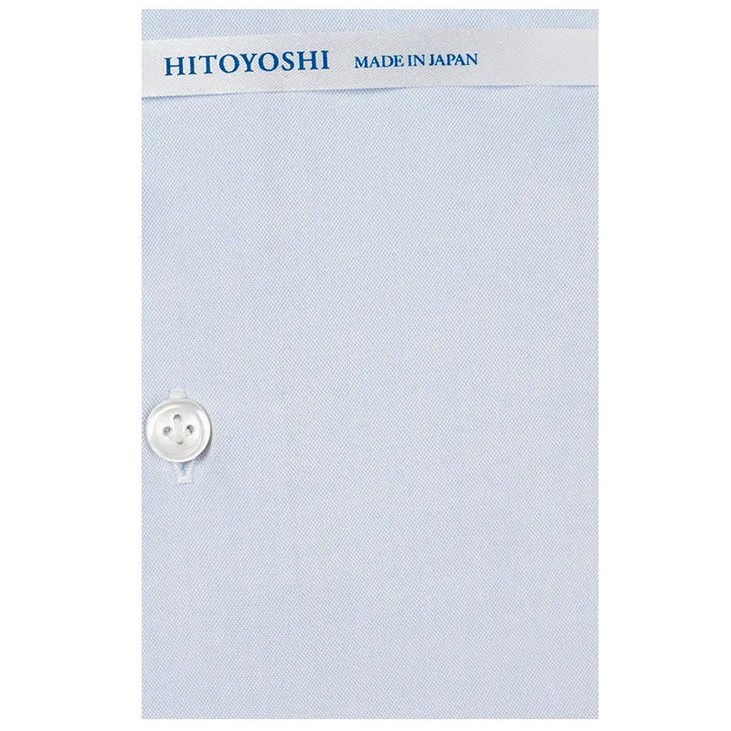 Button close-up detail of the Hitoyoshi Spread Collar Soothing Light Blue shirt