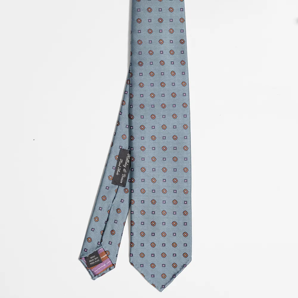 Full view of the Holliday & Brown floral tie in light blue showing elegant floral pattern and refined proportions.