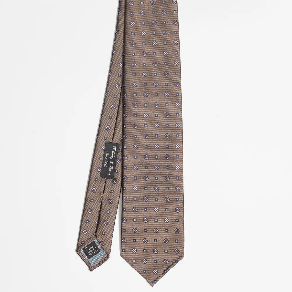 Full view of the Holliday & Brown floral tie in olive showing elegant floral pattern and refined proportions.