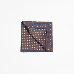 Folded view of the Holliday & Brown pocket square showing pattern placement and finishing detail.