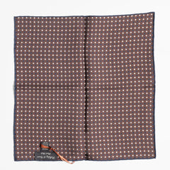 Close-up of the brown dot pattern highlighting silk texture and precise weaving detail.