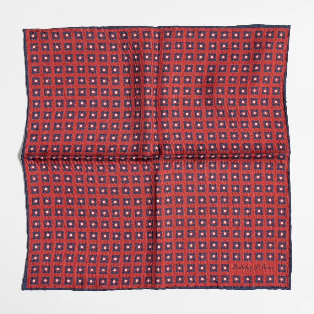 Full view of the Holliday & Brown dot pocket square in red showing classic polka dot pattern and refined proportions.