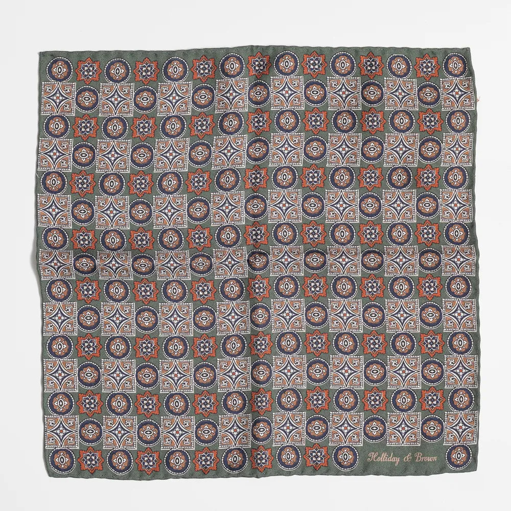 Full view of the Holliday & Brown paisley pocket square in green showing elegant pattern and refined proportions.