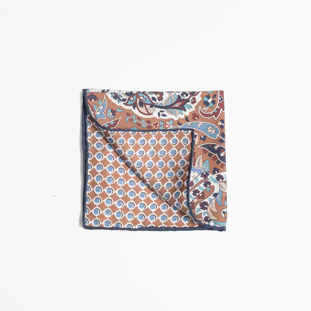 Folded view of the Holliday & Brown pocket square showing pattern placement and finishing detail.