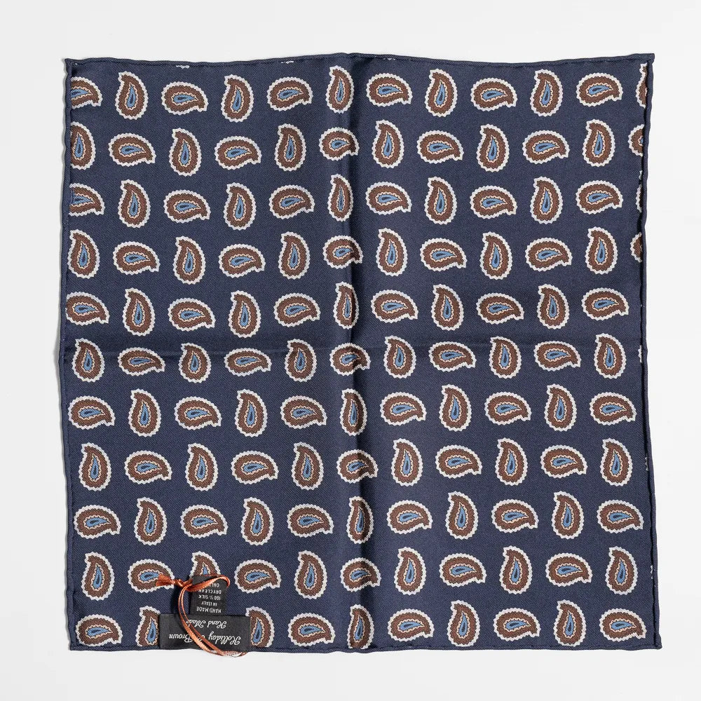 Close-up of the navy paisley pattern highlighting silk texture and intricate weaving detail.