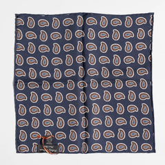 Close-up of the navy paisley pattern highlighting silk texture and intricate weaving detail.