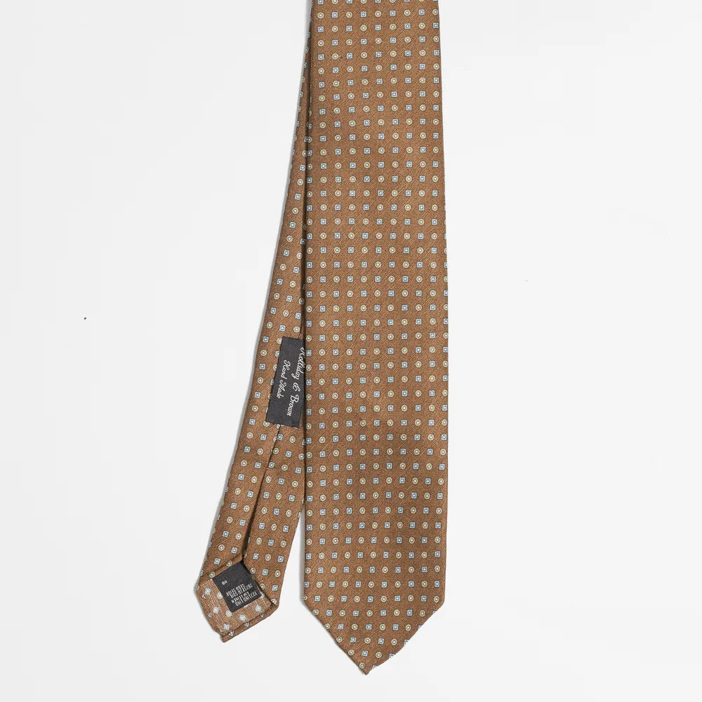 Full view of the Holliday & Brown small floral tie in brown, blue, and green showing delicate pattern and refined proportions.