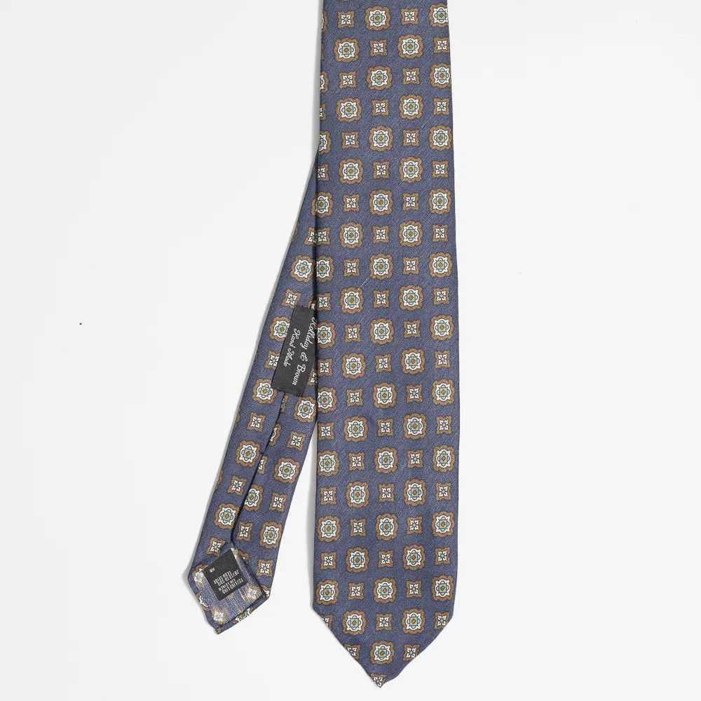 Full view of the Holliday & Brown small floral tie in navy and brown showing delicate pattern and refined proportions.
