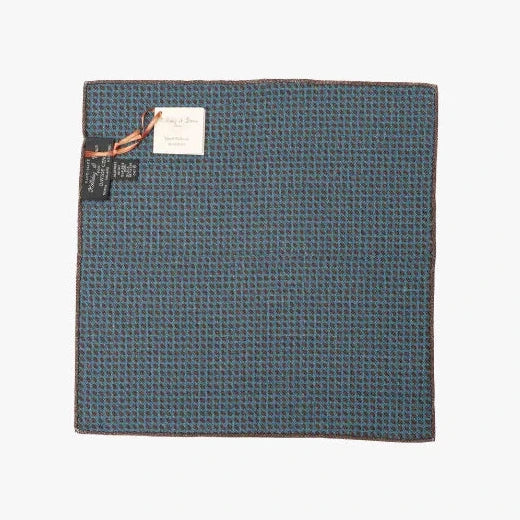 black view of the Holliday & Brown pocket square in blue paisley, showing the full pattern layout, border design, and rich blue tones.